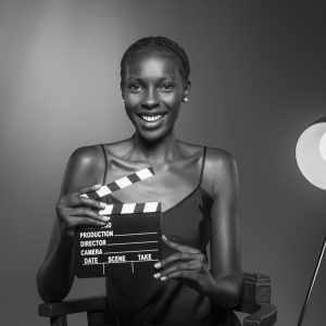 black-white-portrait-woman-with-clapperboard-old-hollywood-glamour-style